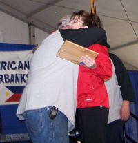 Harold Groetsema gets an unexpected congratulation hug from Alaska Governor, Sarah Palin